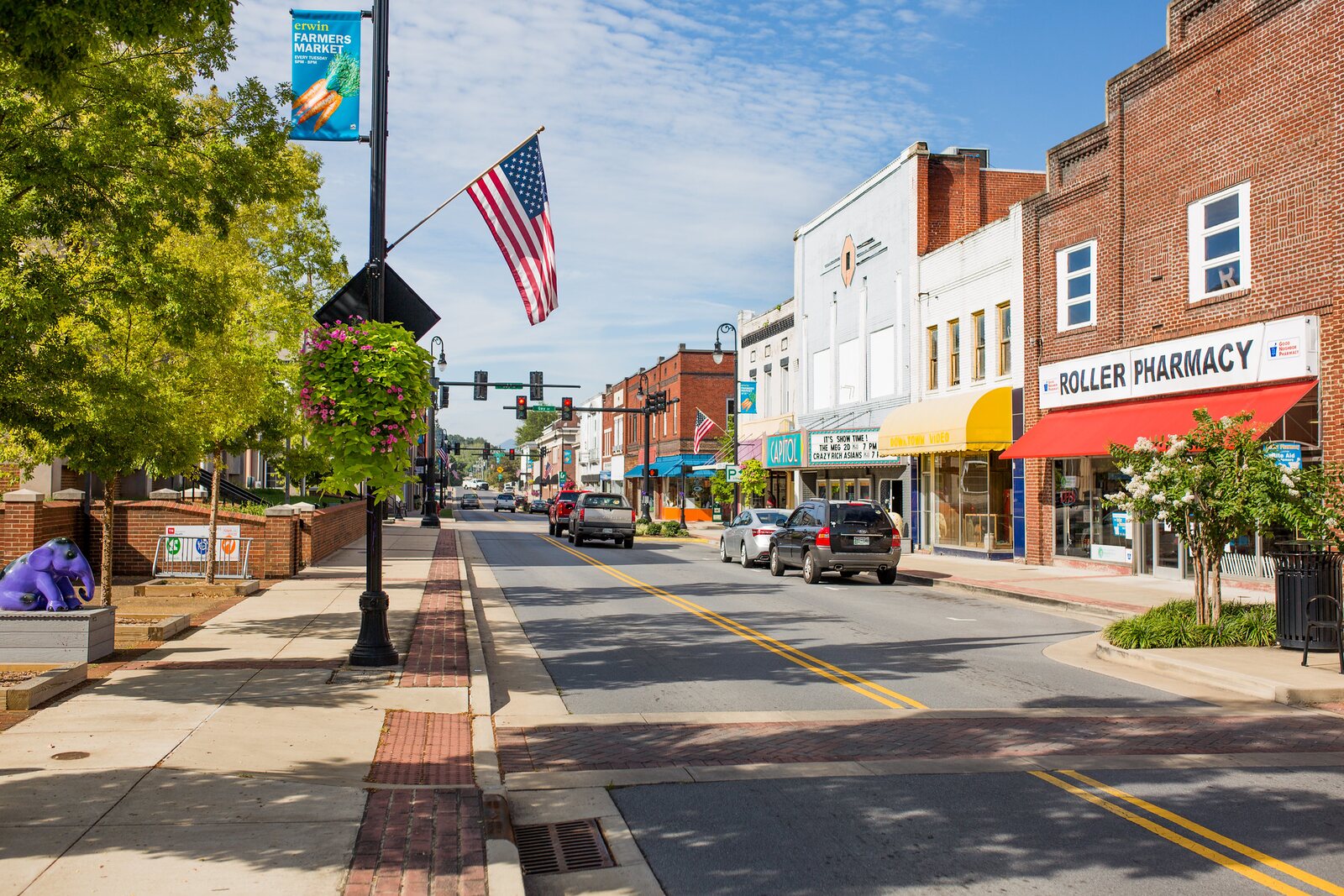 Downtown Erwin, Tennessee street with shops and an American flag