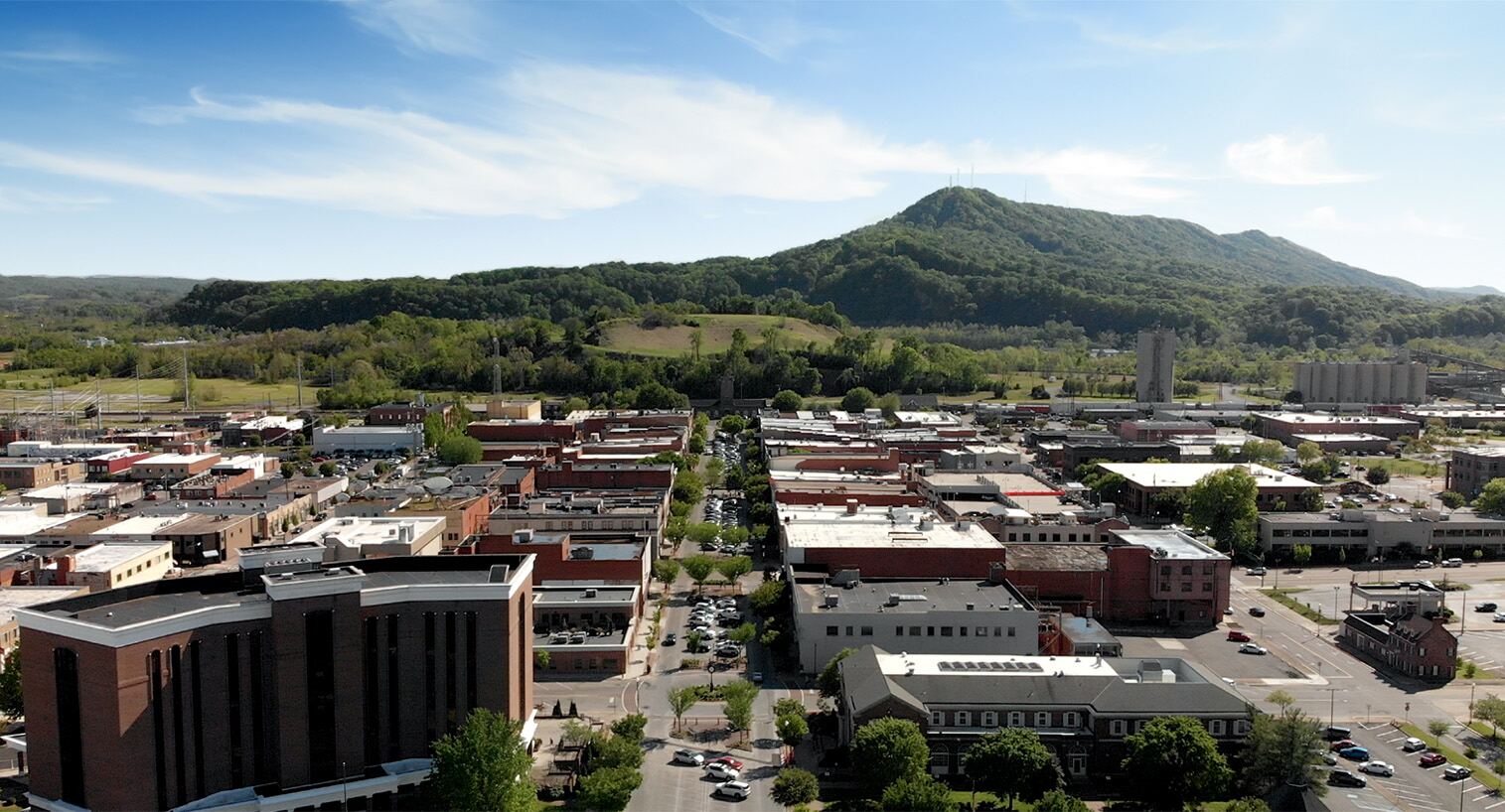 Aerial view of Kingsport, Tennessee with mountains behind downtown