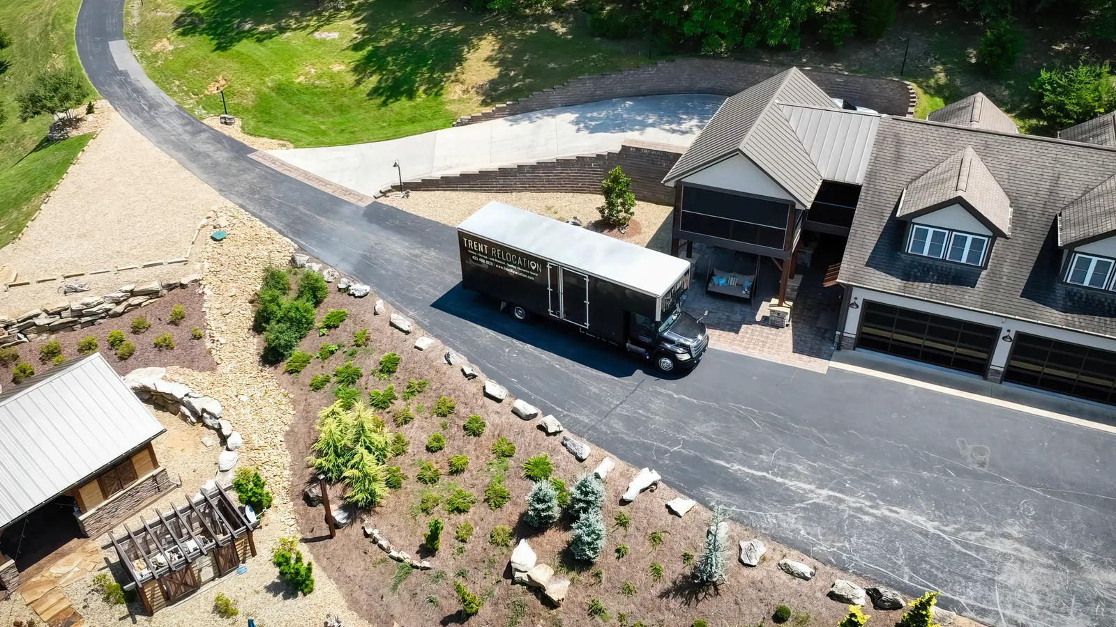 Trent moving truck parked outside a home for a long distance move