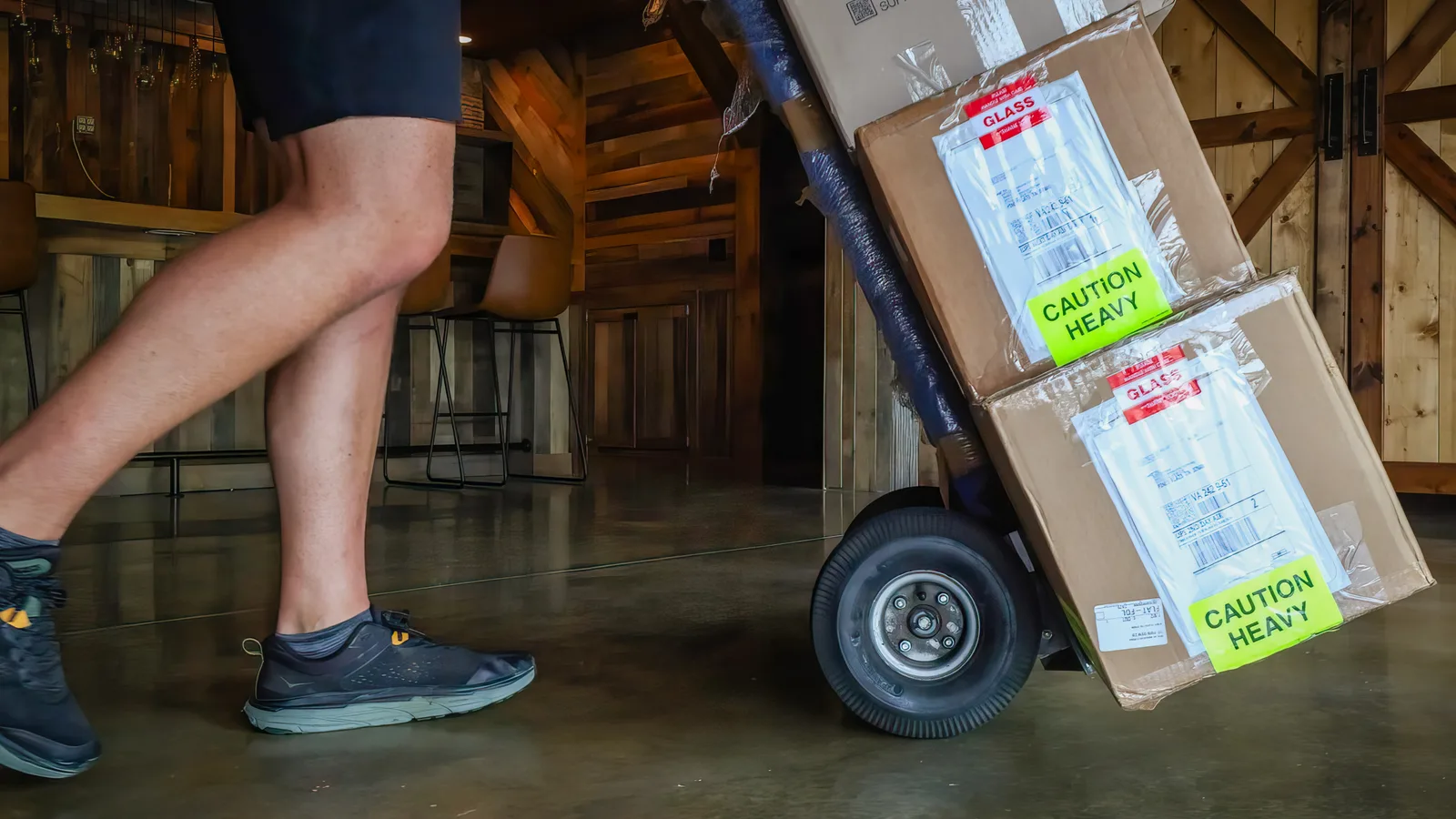 Packed moving boxes on a hand truck for storage